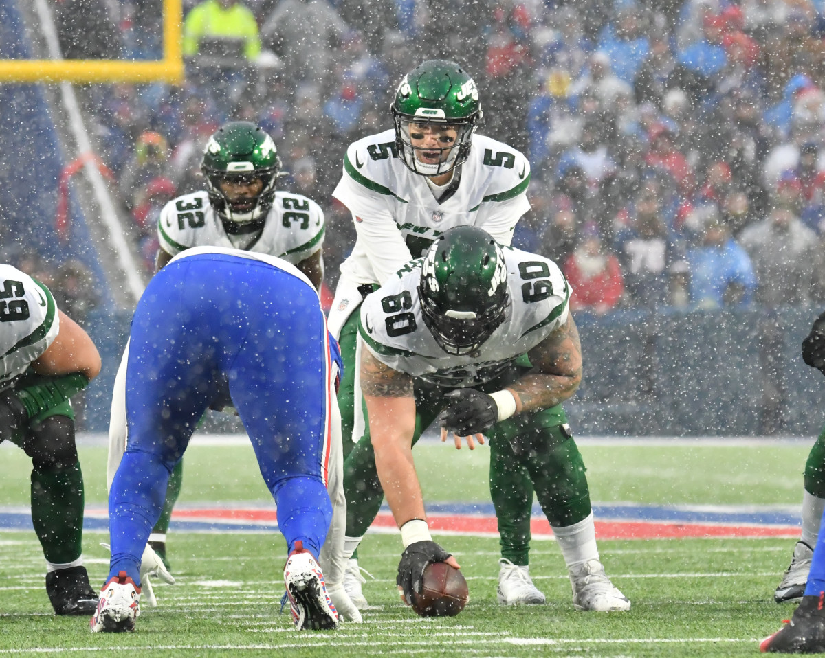 Center Connor McGovern snaps the ball in a 2022 at Buffalo